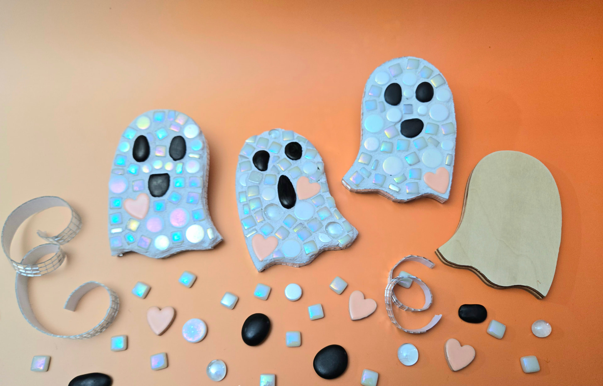 A sparkly disco ghost mosaic with iridescent tiles, mirrored disco tile border, and bonus mummy and candy corn mosaics